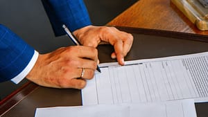 Man signs up on document