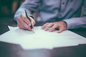 Man signs documents